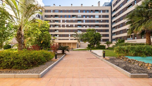 A modern multi-story building with a central courtyard. - Holidays2Malaga Eslava in a closed Urbanization (Málaga)