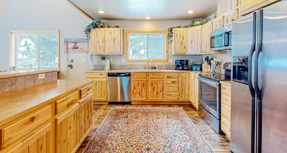 Dog-friendly wilderness retreat with a fireplace, deck, & grill - pool access