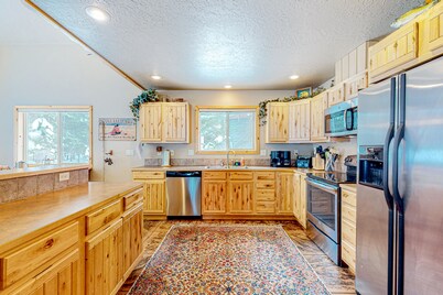 Dog-friendly wilderness retreat with a fireplace, deck, & grill - pool access