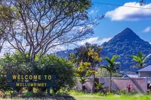 Experience the tranquility of Mullumbimby, surrounded by lush tropical vegetation and majestic mountain scenery.