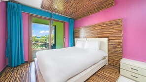 A bedroom with a large bed, wooden panel wall, and a view of the outdoors. - Geojedo Pilos Ocean View Pension (Geoje)
