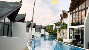 A modern resort with a swimming pool, contemporary architecture, and outdoor seating areas. - Exclusive Villa F3 with Jacuzzi - MANA VILLAS (Benoa)