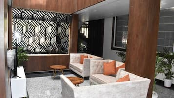 Deluxe Room | Living area | Smart TV