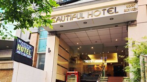 The entrance to a hotel with a sign reading "Beautiful Hotel". - Beautiful Saigon Hotel (Ho Chi Minh City)