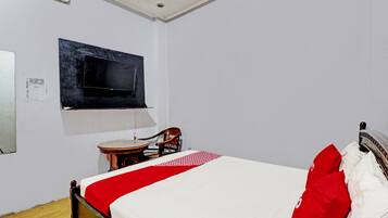Laptop workspace, bed sheets