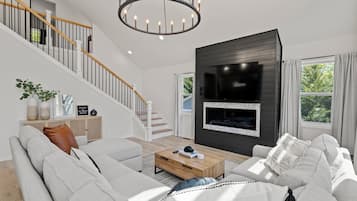 Smart TV, fireplace, books, offices