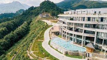 Indoor pool, outdoor pool, open 7:00 AM to 9:00 PM, pool umbrellas