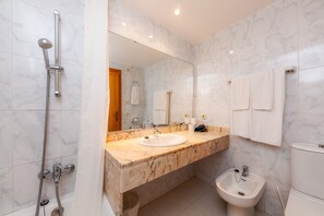Bathtub, hair dryer, towels