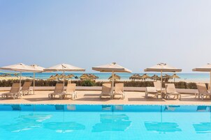 Indoor pool, outdoor pool, open 10:00 AM to 6:00 PM, pool umbrellas