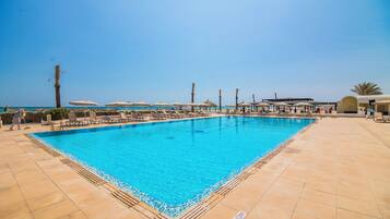 Indoor pool, outdoor pool, open 10:00 AM to 6:00 PM, pool umbrellas