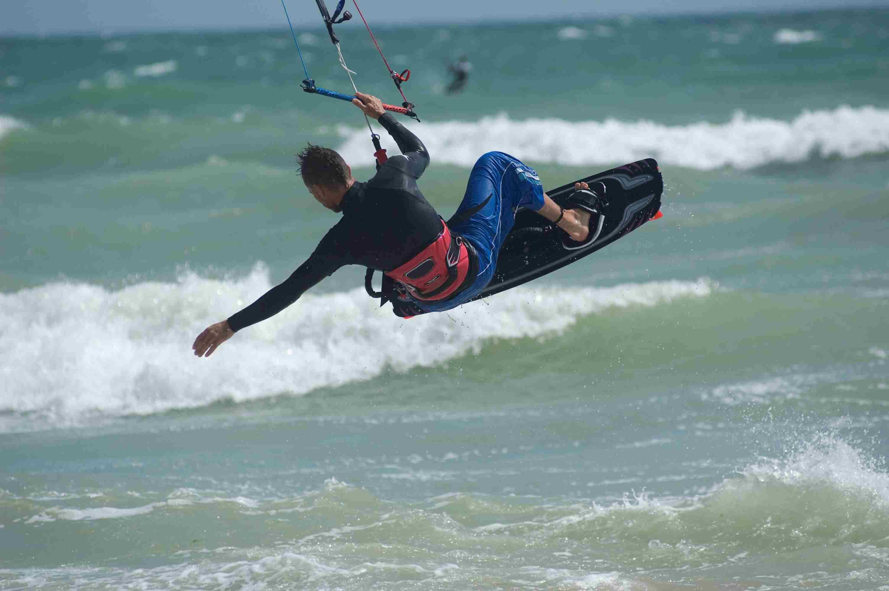 A person kiteboarding on the ocean.