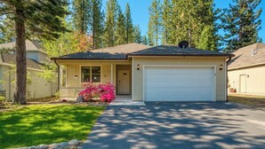 A single-story house with a garage, a front porch, and a well-maintained lawn. - Sequoia Pines - 411 Sequoia Circle (Plumas Eureka)