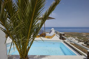 Seasonal outdoor pool, pool umbrellas, pool loungers
