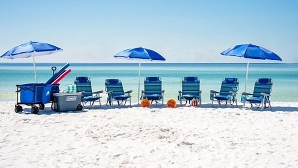 A beach with blue umbrellas and beach chairs lined up. - Andrea's Island*Golf Cart*Bikes*BeachSvc+ExtraGear! (DESTIN)