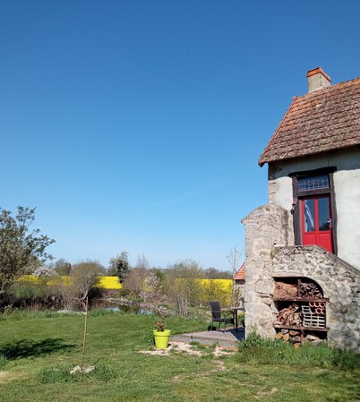 rural cottage with garden overlooking the swimming pond