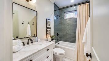 Bathtub, hair dryer, towels