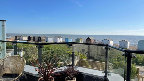 Stylish and spacious coastal retreat with sea views