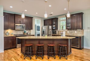 Fridge, dishwasher, coffee/tea maker, cookware/dishes/utensils