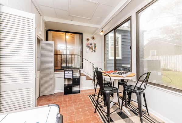 Enjoy meals in the dining area with a round table and four chairs, and take in the view from the large window.