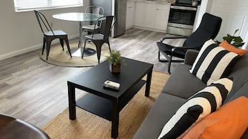 Standard Room | Living area | 55-inch TV with digital channels