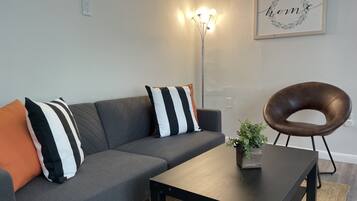 Standard Room | Living area | 55-inch TV with digital channels