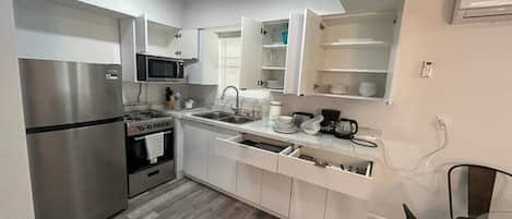 Family Apartment | Private kitchen | Full-size fridge, microwave, coffee/tea maker, cookware/dishes/utensils