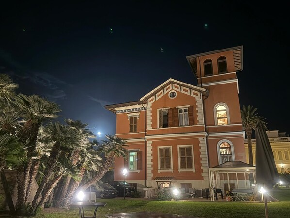 A multi-story building with a classic architectural style, featuring a central balcony and a tower-like structure on the right. - Palazzo Moresco (Santa Marinella)