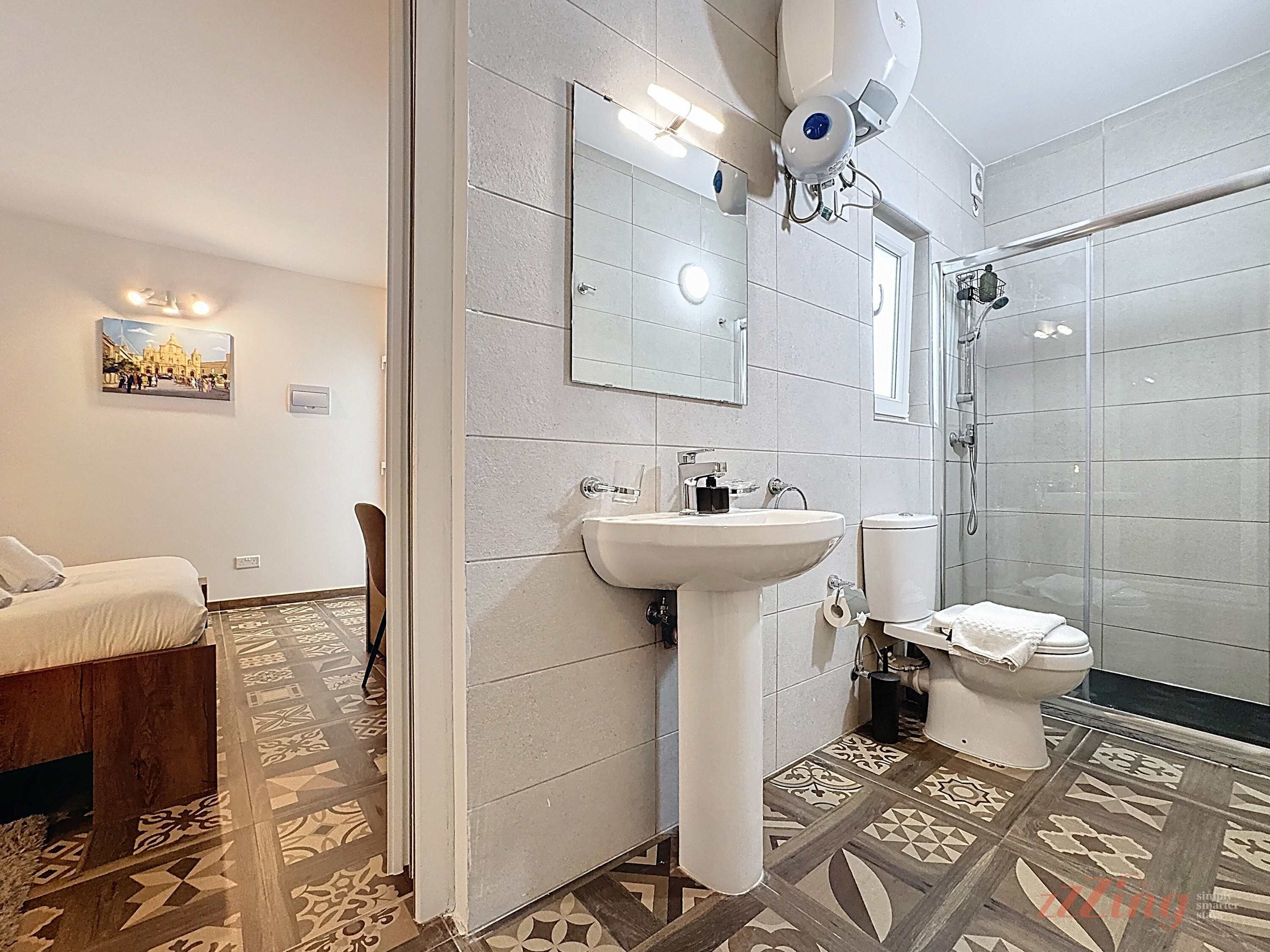 Shower, hair dryer, towels, shampoo
