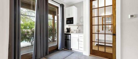 Fridge, microwave, coffee/tea maker, cookware/dishes/utensils