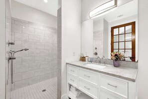 Shower, hair dryer, towels, soap