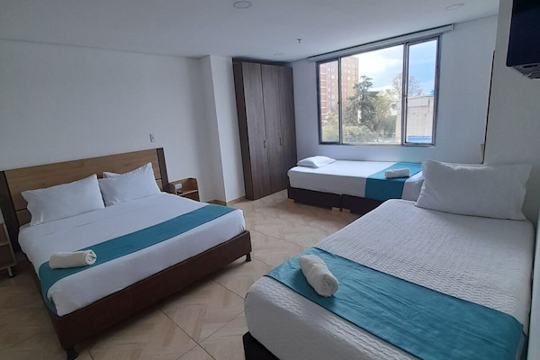 Family Quadruple Room | Down comforters, pillowtop beds, desk, laptop workspace