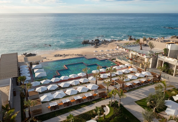 A resort with a pool, beach, and ocean view. - Grand Velas Boutique Hotel - Adults Only - All Inclusive (Cabo San Lucas)