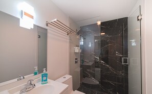 Shower, hair dryer, towels, soap