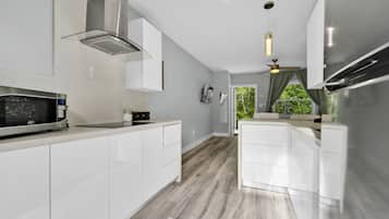 Fridge, microwave, stovetop, coffee/tea maker