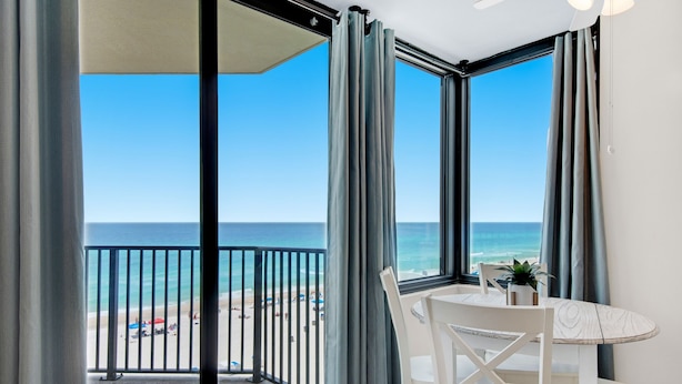 A balcony with a view of the beach and ocean. - 🏖️Stunning Gulf Views | 3 Pools | Sunbird 709W- Beach Life🏖️ (Panama City Beach)