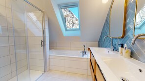Bathtub, hair dryer, towels