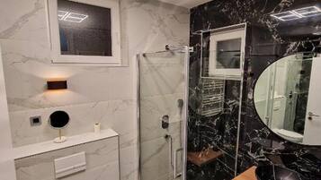 Shower, hair dryer, towels, soap