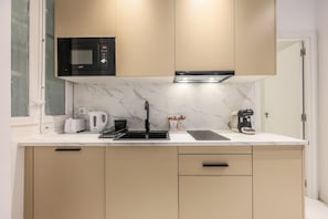 Fridge, microwave, stovetop, coffee/tea maker