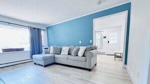 Family Suite | Living room | 50-inch LED TV with digital channels, TV, Netflix