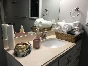 Shower, hair dryer, towels, shampoo