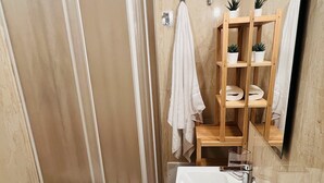 A bathroom with a shower, toilet, sink, and a mirror. - Sweet Home Catania  A (Catania)