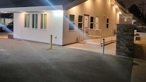 A modern building with a flat roof, a covered entrance, and a sign for Stafford Inn. - Stafford Inn (Redwood City)