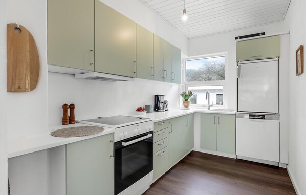 Fridge, stovetop, dishwasher, coffee/tea maker