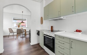 Fridge, stovetop, dishwasher, coffee/tea maker