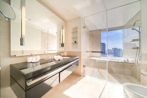 Bathtub, hair dryer, towels, soap