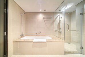 Bathtub, hair dryer, towels, soap
