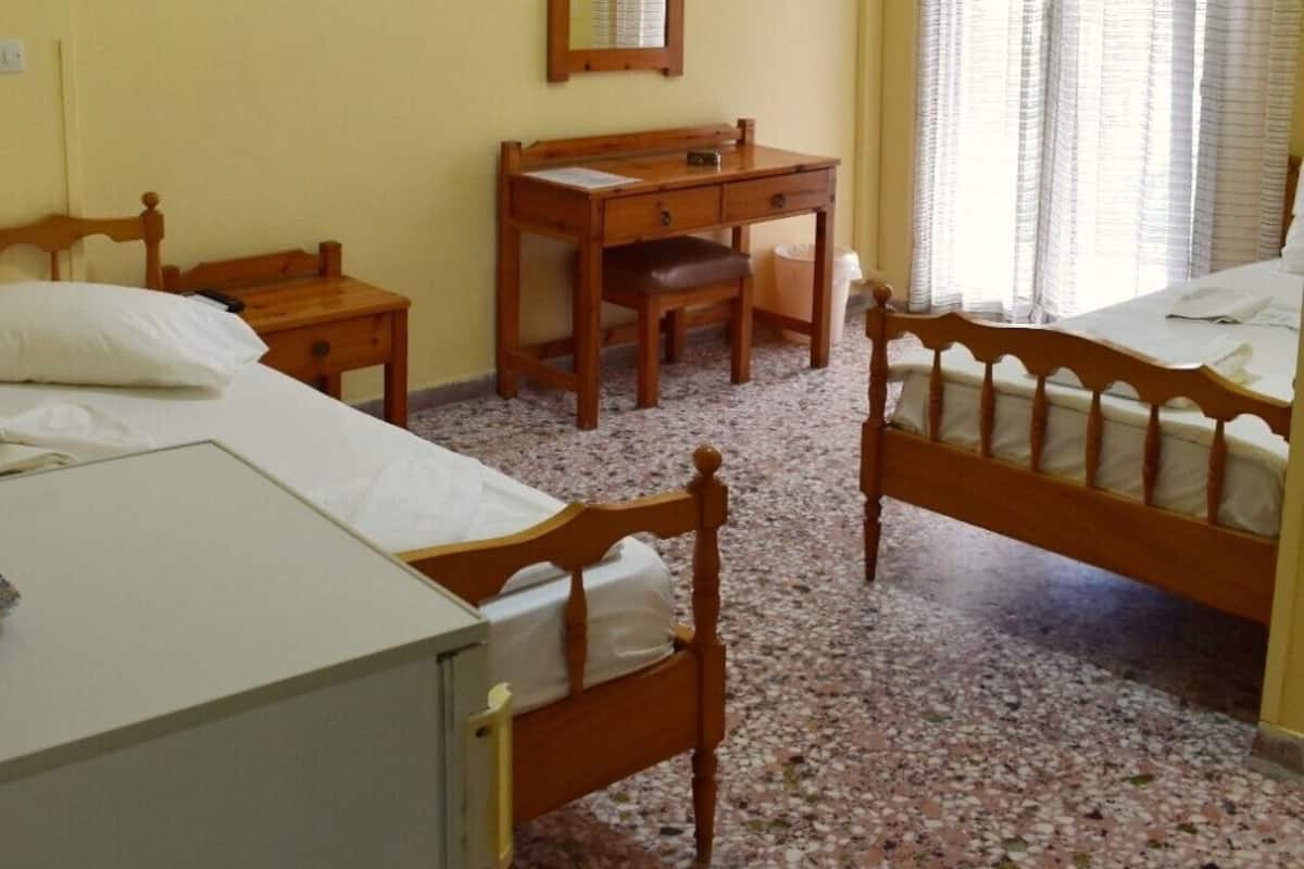 Standard Triple Room, Partial Sea View | In-room safe, iron/ironing board, free WiFi, bed sheets