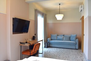 Junior Studio Suite, 1 Queen Bed with Sofa bed, Sea View | Living area | 32-inch flat-screen TV with cable channels, TV
