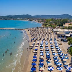 On the beach, white sand, sun loungers, beach umbrellas
