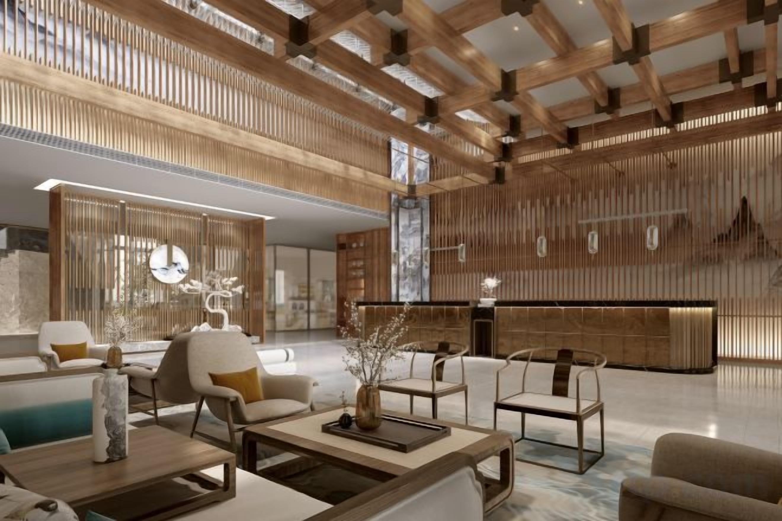 A spacious lobby with high ceilings, wooden paneling, and modern furnishings including sofas and tables.